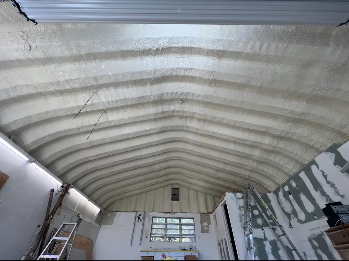Spray polyurethane foam applied to the underside of a metal roof deck in Mishawaka